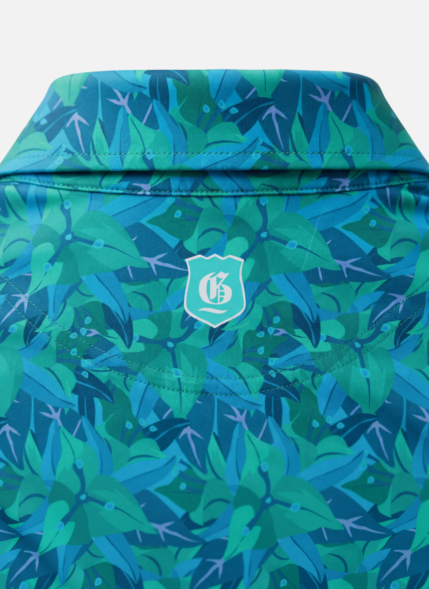 Men's Turks & Caicos Polo shirt from Tropical Dawn Collection, featuring a casual fit and vibrant tropical print.