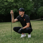 Black men's tournament cap from the Originals Collection, stylish men's hat with adjustable fit and classic design.