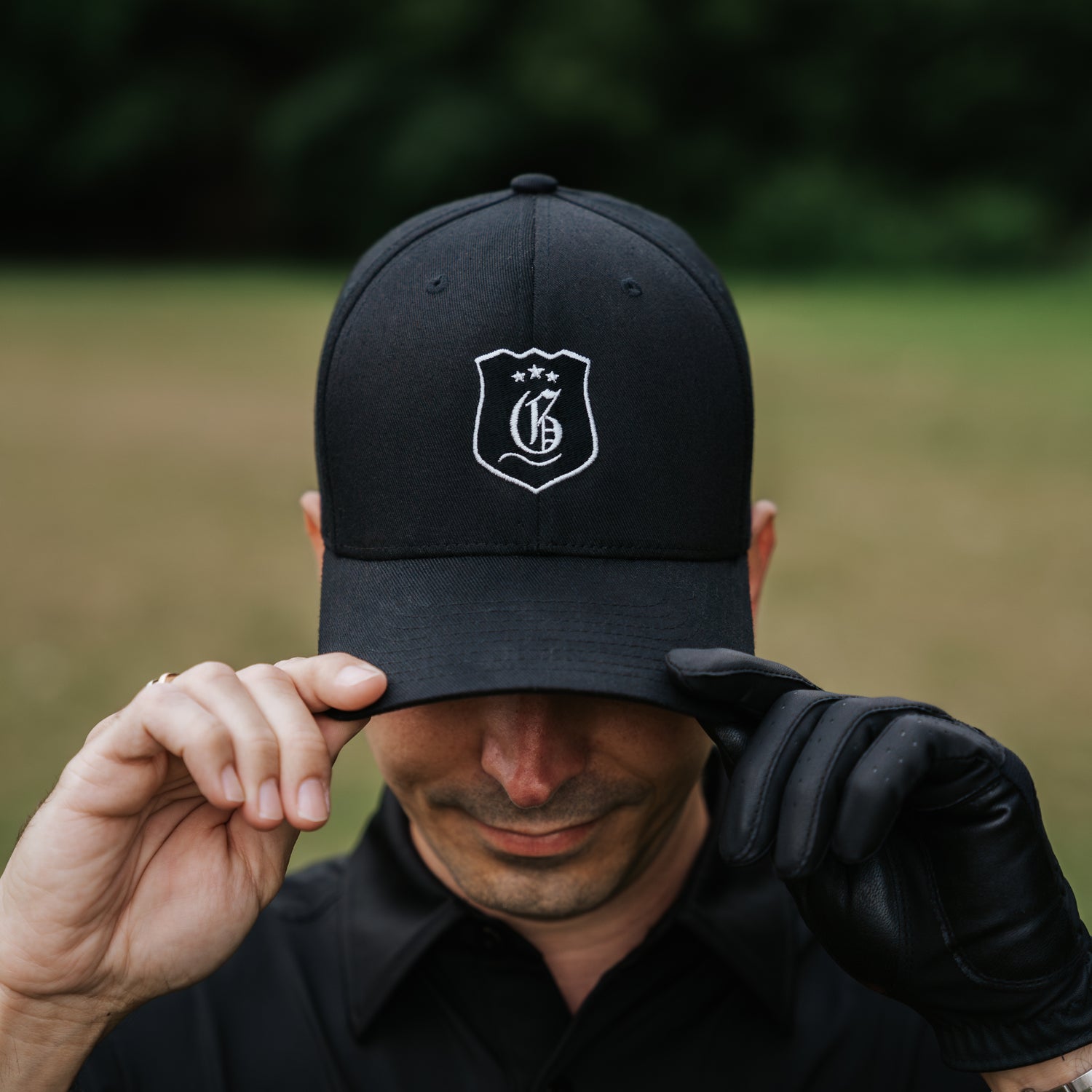 Black men's tournament cap from the Originals Collection men's hats line, featuring a classic design and adjustable fit.