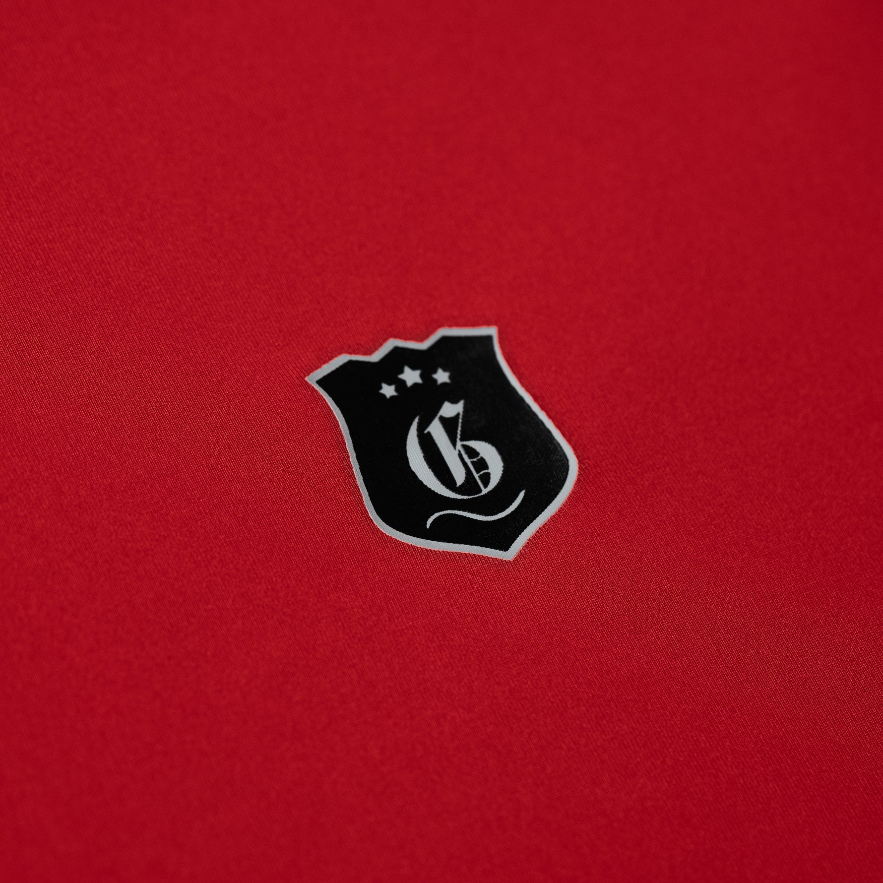 Red men's Victory Polo shirt from Originals Collection, featuring a classic collar and short sleeves.